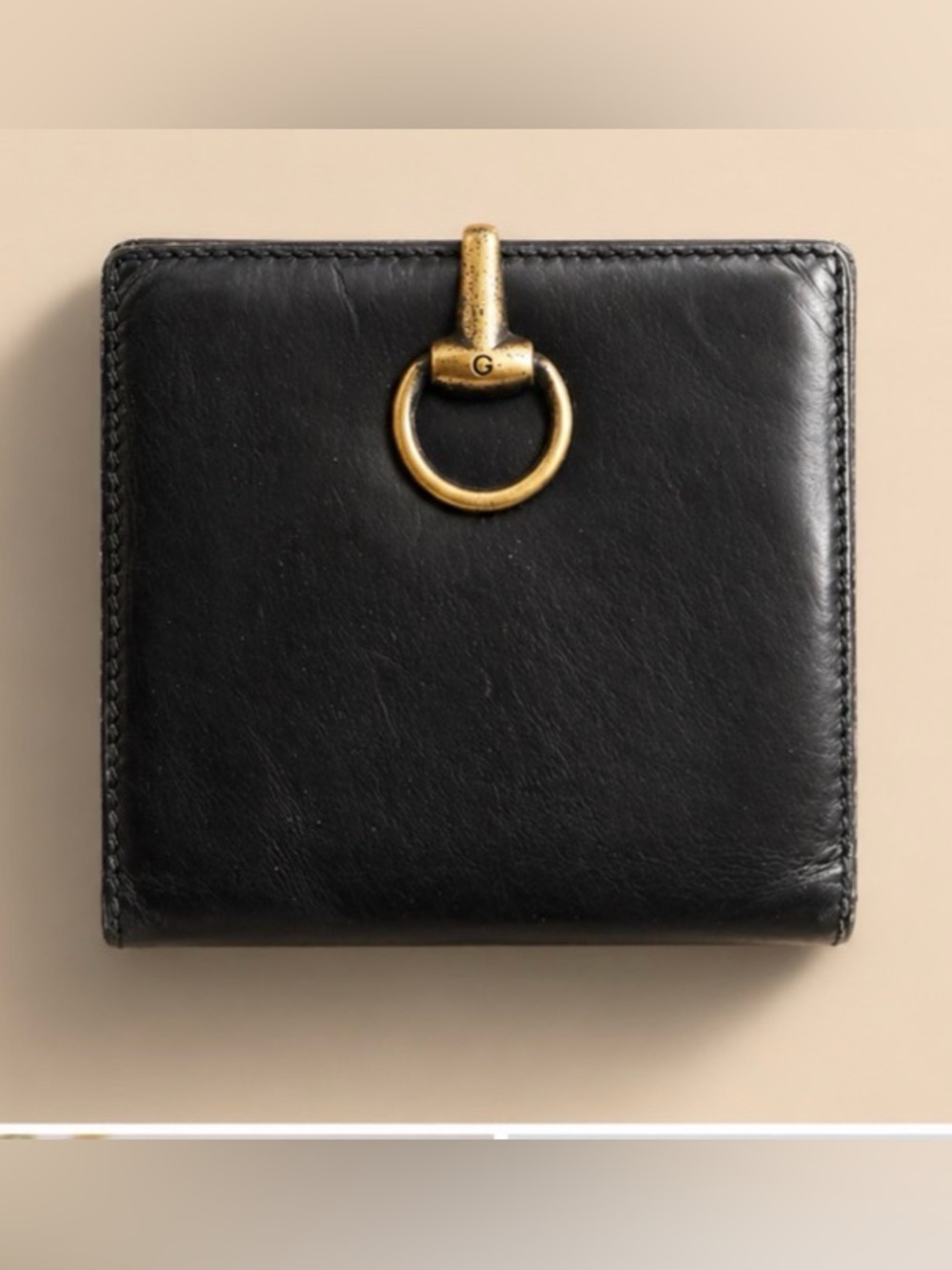 Gucci Black Leather Bifold Wallet with Gold Ring Accent